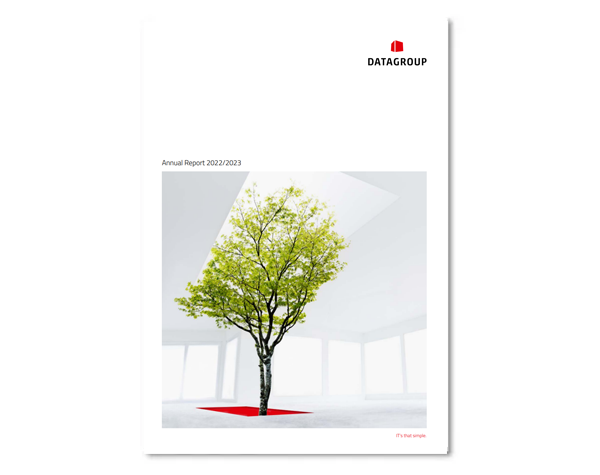 Cover page of the DATAGROUP Annual Report 2022/2023 featuring a green tree growing through a red square in the middle of a bright, modern white room.