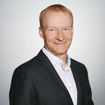 Portrait von Joachim Rath, der freundlich in die Kamera blickt.