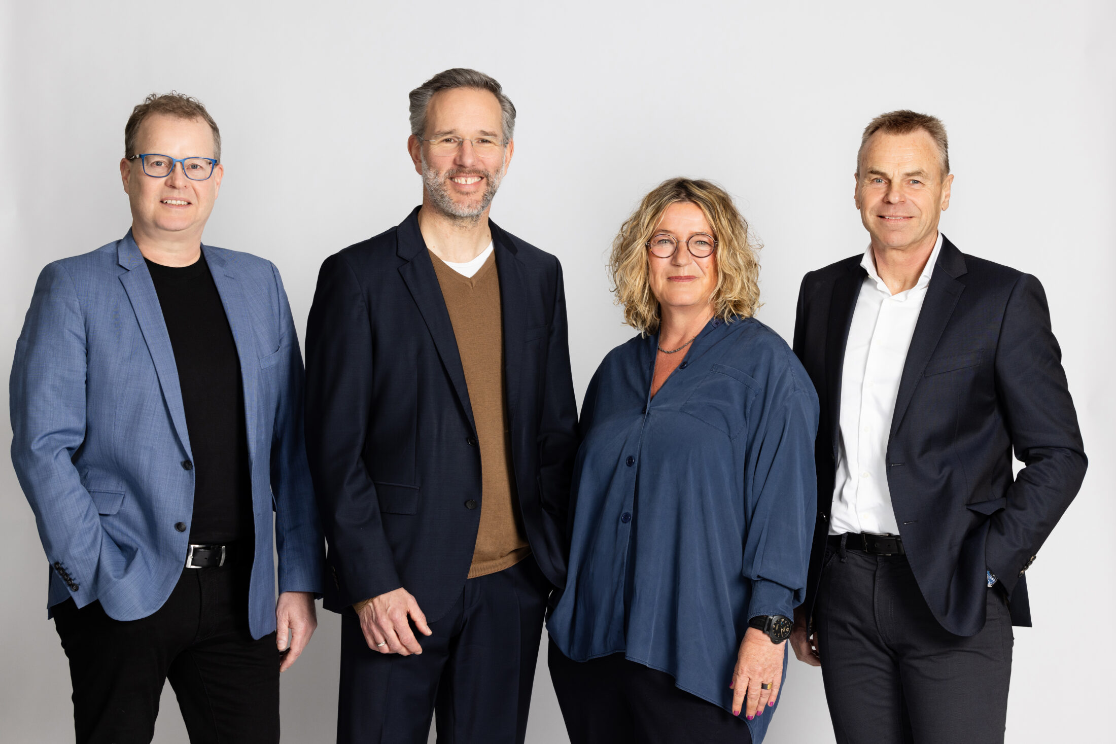 Photo of the members of the DATAGROUP Executive Board. From left to right: Mark Schäfer, Andreas Baresel, Alexandra Mülders, Gerhard Kaminski