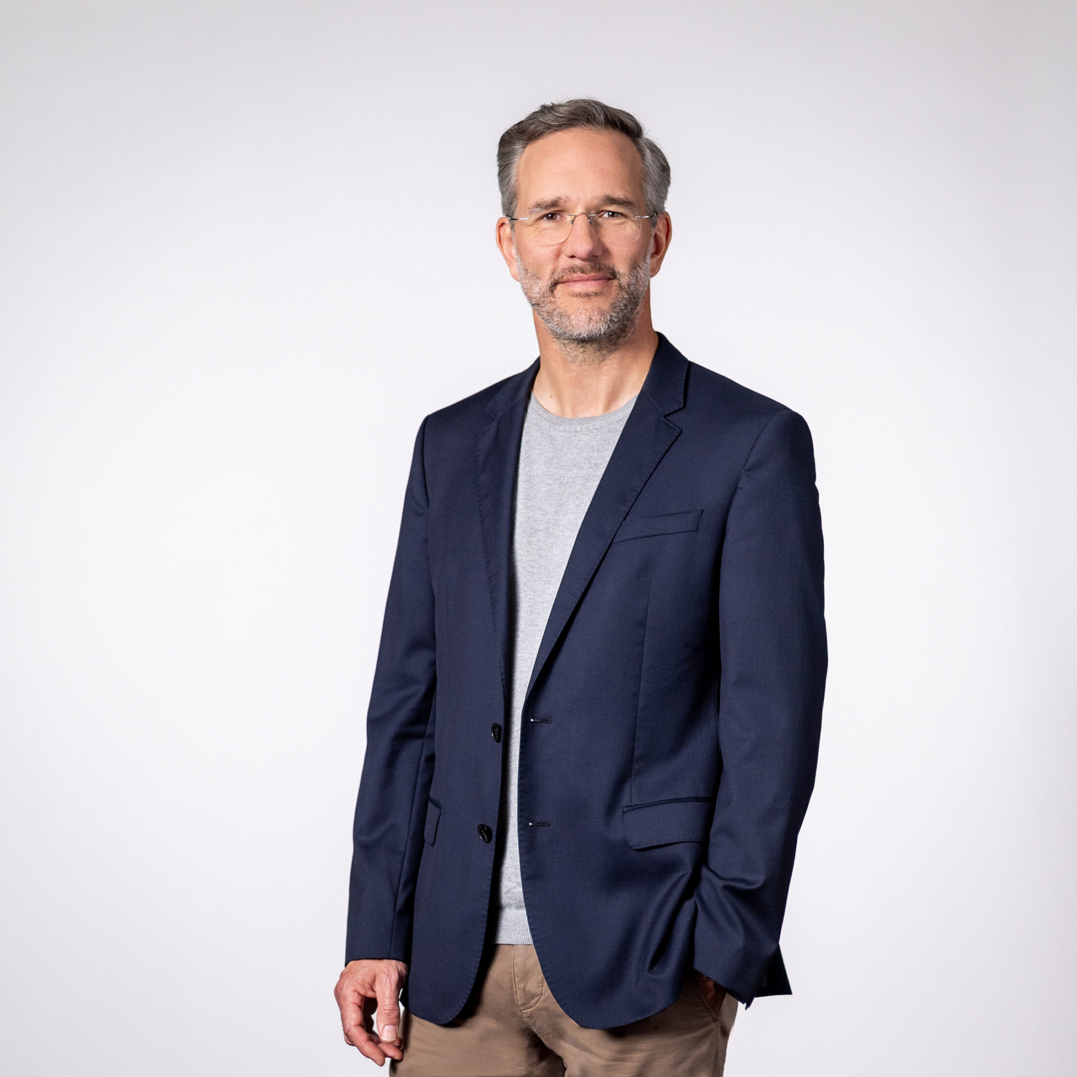 Photo of Andreas Baresel – CEO of DATAGROUP – wearing a suit in front of a light gray background