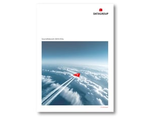 Cover page of the DATAGROUP Annual Report 2023/2024 featuring a stylized red paper airplane drawing a white contrail across a blanket of clouds.